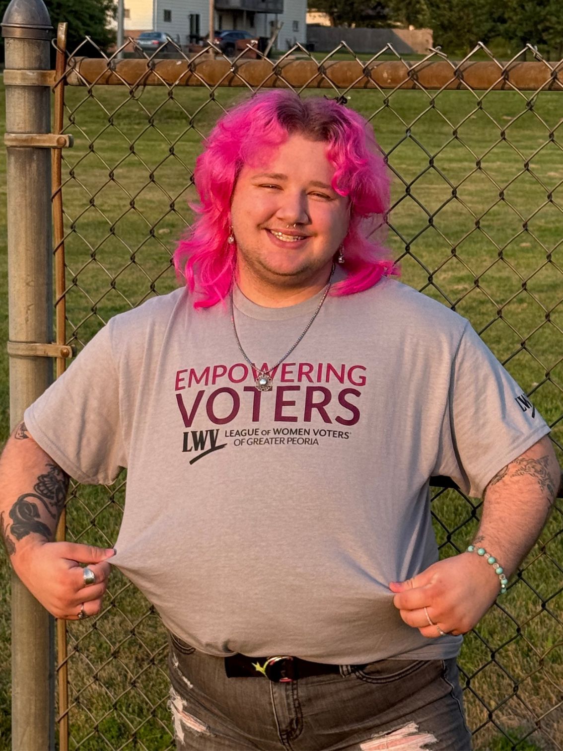Person wearing shirt that states "Empowering Voters"